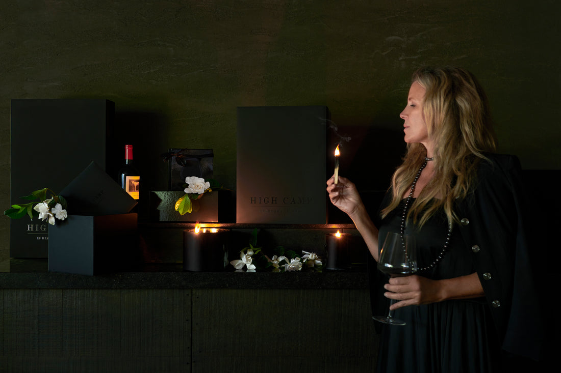 image of woman lighting palo santo