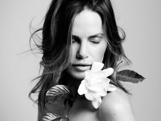 woman with beautiful white gardenia flower