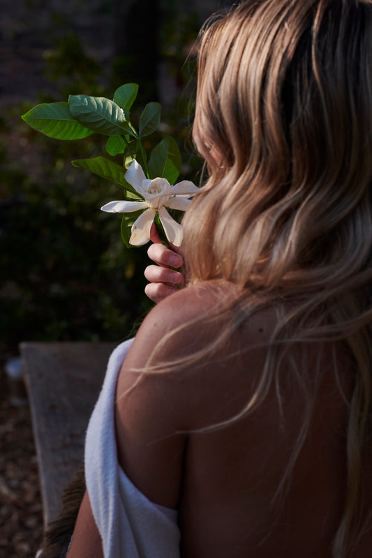 Girl holding gardenia